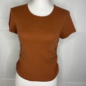 Brown cinched on the side T-shirt in the size large